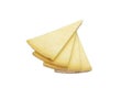 Triangular slice of old cheddar cheese. Piece of yellow cheese with sliced pieces on white background Royalty Free Stock Photo