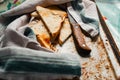 Triangular slices of toasted white bread with a soft texture inside and a crisp crust on the outside on a rusty metal background Royalty Free Stock Photo