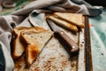 Triangular slices of toasted white bread with a soft texture inside and a crisp crust on the outside on a rusty metal background Royalty Free Stock Photo