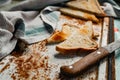 Triangular slices of toasted white bread with a soft texture inside and a crisp crust on the outside on a rusty metal Royalty Free Stock Photo