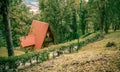 Triangular timber roof shelters and trees in the forest in zirahuen lake Royalty Free Stock Photo