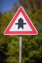 Triangular traffic sign for a crossroads Royalty Free Stock Photo