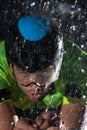 A triathlete braving the rain as he cycles through the night, preparing himself for the upcoming marathon. The blurred