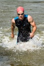 Triathlete is comming out of the water