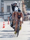 Triathlete Katie Zaferes cycling, followed by competitors