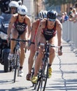 Triathlete Katie Zaferes cycling, followed by competitors