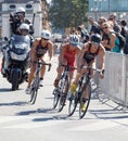 Triathlete Katie Zaferes cycling, followed by competitors