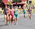 Triathlete Sarah True running, followed by many competitors