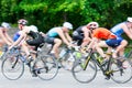 Triathletes ride speed cycles back and forth during triathlon competition