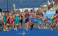 Triathletes start running after the cycle part in the transition Royalty Free Stock Photo
