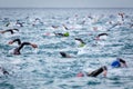 Triathletes swim on start of the Ironman triathlon competition