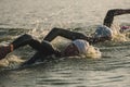 Triathletes swim on start of the Ironman triathlon competition