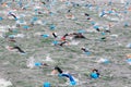 Triathletes swim on start of the triathlon competition in Moscow River,