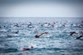 Triathletes in water in the Ironman triathlon competition at Calella beach