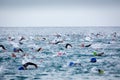 Triathletes in water in the Ironman triathlon competition at Calella beach