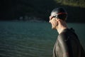 Triathlon athlete starting swimming training on lake Royalty Free Stock Photo