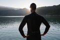 Triathlon athlete starting swimming training on lake Royalty Free Stock Photo