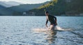 Triathlon athlete starting swimming training on lake Royalty Free Stock Photo