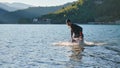 Triathlon athlete starting swimming training on lake Royalty Free Stock Photo