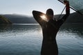 Triathlon athlete starting swimming training on lake Royalty Free Stock Photo