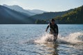 Triathlon athlete starting swimming training on lake Royalty Free Stock Photo