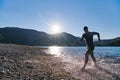 Triathlon athlete starting swimming training on lake Royalty Free Stock Photo