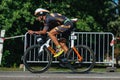 Triathlon biking man cycling on road bike at top speed on the triathlon race