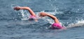 Triathlon swimmers churning up the water two swimmers Royalty Free Stock Photo