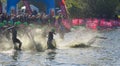 Triathlon swimmers entering open water swim stage.