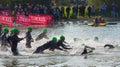 Triathlon swimmers entering open water swim stage.