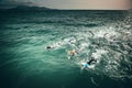 Triathlon swimmers train in open water Royalty Free Stock Photo