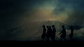 Tribal African Men Walking close to Mount Kilimanjaro Under Storm