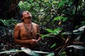 Tribal elder Binan Tukum hunting with his son for monkeys in the rainforest