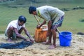 Tribal fishermen catch fish with fishing nets in the creek. Tribals have their own method of fishing.