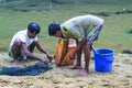 Tribal fishermen catch fish with fishing nets in the creek. Tribals have their own method of fishing