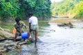 Tribal fishermen catch fish with fishing nets in the creek. Tribals have their own method of fishing