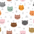 Tribal seamless pattern with cartoon cats. Abstract geometric art print. Hand drawn ethnic background with cute animals. Kitten Royalty Free Stock Photo