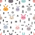 Tribal seamless pattern with cute cartoon bunnies. Abstract geometric print. Hand drawn ethnic background with cute animals. Funny Royalty Free Stock Photo