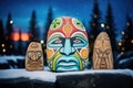 tribal symbols painted on stone with aurora above