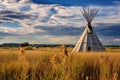 Tribal teepee in the prairie at sunset, South Dakota, First Nations tipis on the open prairies of North America, AI Generated Royalty Free Stock Photo