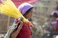 Tribal woman with broom