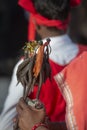 Tribal woman carryingtraditional Sticks with metalk accessaries during Dussera Procession near Jagdalpur,Chattisgarh,India