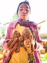 Tribal woman farmer with organic vegetable