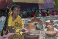 A Tribal woman waiting in a rural market place in Baster.