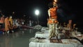 Ganga aarti being performed by Hindu priests to the chants of Vedic hymns.