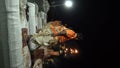 Ganga aarti being performed by Hindu priests to the chants of Vedic hymns.