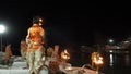 Ganga aarti being performed by Hindu priests to the chants of Vedic hymns.