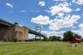 Triborough Bridge at Randalls and Wards Islands in New York City with a Green Grass Field during Spring Royalty Free Stock Photo