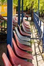 Rows of multi-colored beach volleyball tribune seats Royalty Free Stock Photo