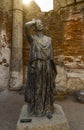 Tribute in bronze statue of the actress Margarita Xirgu in a courtyard of columns of the Roman Theater of Merida with the backlit